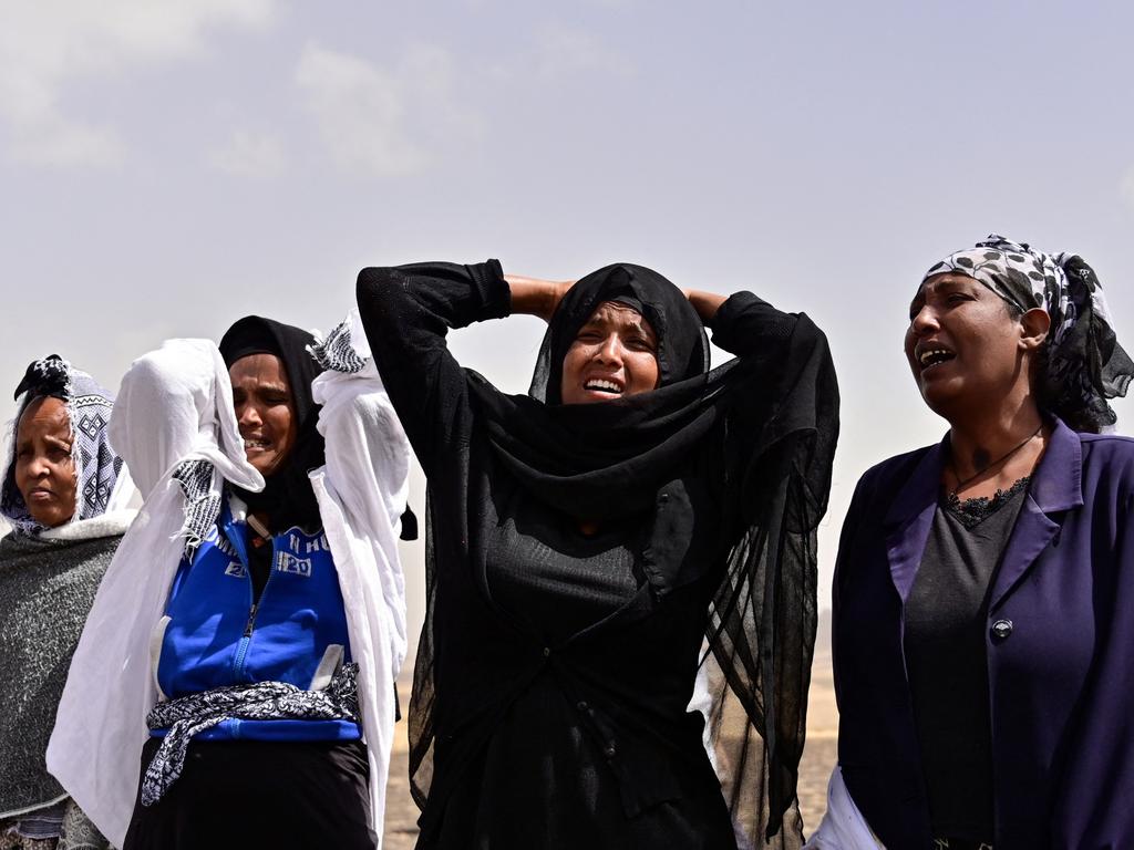 Distraught relatives react as they arrive at the crash site of the Ethiopian Airlines operated Boeing 737 MAX aircraft, at Hama Quntushele village in Oromia region, on March 14, 2019. Picture: Tony Karumba / AFP