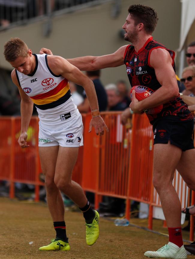 Demon Jesse Hogan gives Crow David Mackay at TIO Traeger Park on Sunday. Picture: Michael Willson/AFL Media/Getty Images