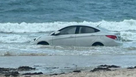 A car has been spotted in the water at Glenelg Beach on Tuesday morning. Picture: FIVEAA