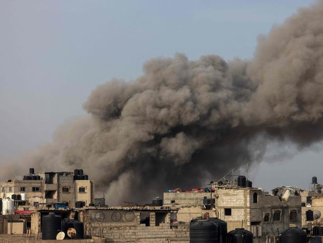 Smoke billows following Israeli bombardment in Rafah, in the southern Gaza Strip, on March 27, 2024, amid the ongoing conflict between Israel and the Palestinian militant group Hamas. (Photo by Mohammed ABED / AFP)