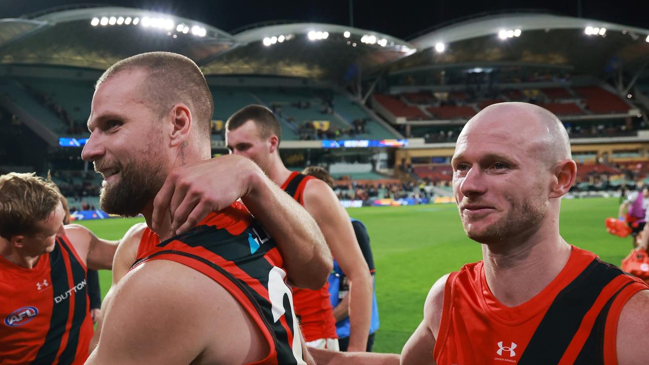 AFL alarm after killer’s shock appearance in Essendon rooms