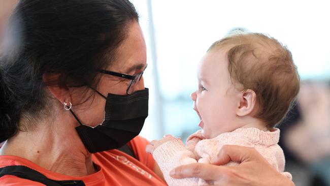 An overjoyed Mary Clarke holds her excited granddaughter Arabella at Adelaide Airport on the first day of the border opening to the rest of the country. Picture: NCA NewsWire / David Mariuz