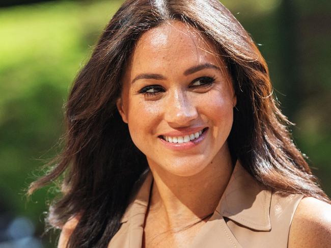 (FILES) In this file photo taken on October 01, 2019 Meghan Markle, the Duchess of Sussex arrives at the University of Johannesburg, South Africa. - Meghan Markle, the Duchess of Sussex, marked her 40th birthday August 4, 2021 with a video asking celebrity friends to help women get back to work after the pandemic. (Photo by Michele Spatari / AFP)