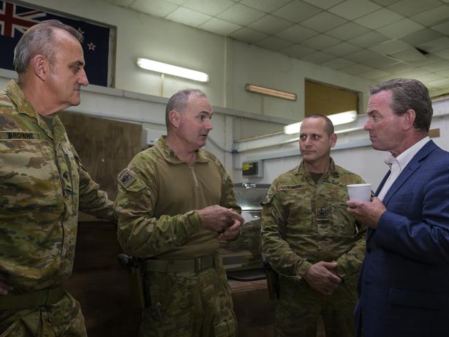 Defence Minister Christopher Pyne with Australian Army soldier Warrant Officer Anthony Charles (centre), who is deployed to Task Group Taji-8, during a visit to the Taji Military Complex, Iraq. Picture: Defence Media