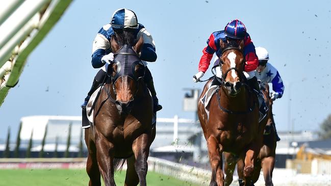 Kyle Wilson-Taylor rides Odinson (left) to victory at Doomben for trainer Ciaron Maher and owner Ozzie Kheir. Picture: Grant Peters/Trackside Photography