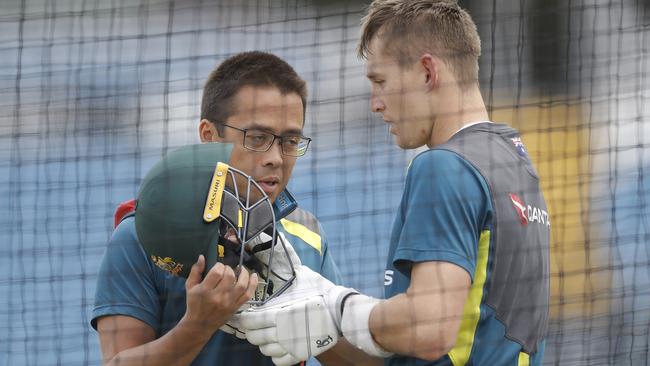 The medical staff check on Marnus Labuschagne after he was hit by a Starc thunderbolt.