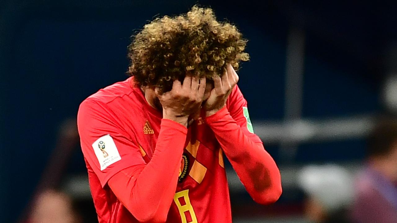 Belgium's midfielder Marouane Fellaini reacts after his shot misses the target.