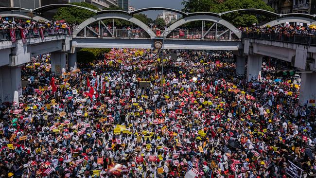 Thousands protest against the coup at Yangon’s Sule Square on Wednesday. Picture: Getty Images