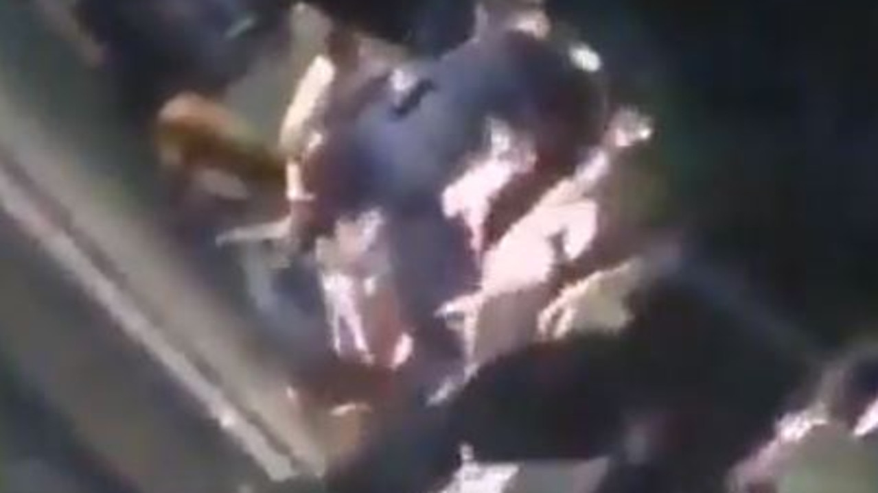 The video captures one of the police officers using his knee to pin the man to the ground.