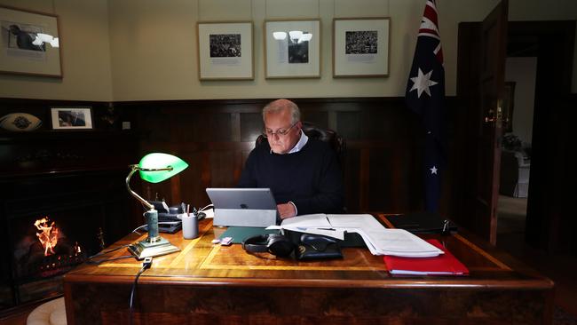 Prime Minister Scott Morrison working on his pre-budget address at The Lodge which will be delivered today at the National Press Club. Picture: Adam Taylor