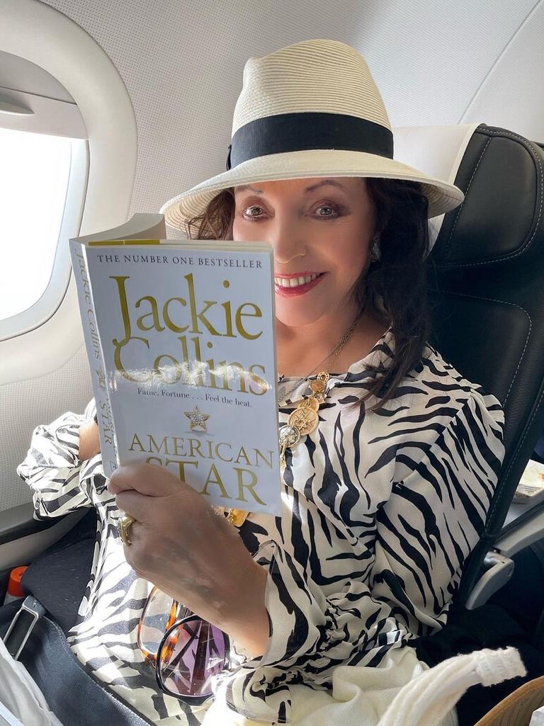 Reading one of her late sister Jackie’s books.