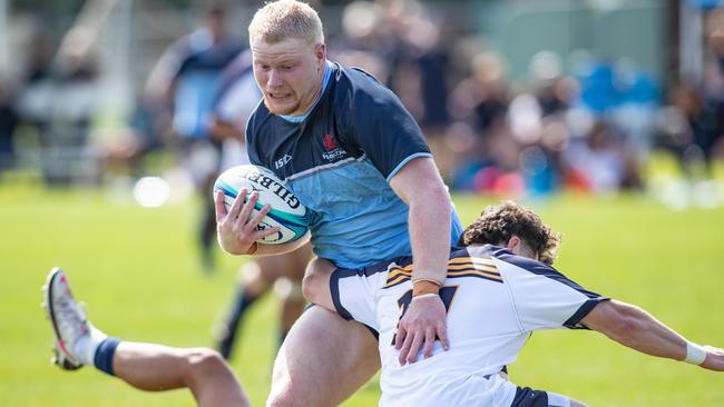 Jamie Clark makes a break in the NSW Waratahs match against the ACT Brumbies.