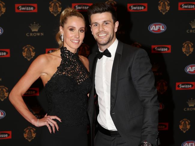 His teammate Trent Cotchin, with wife Brooke, opted for the bow tie. Picture: Michael Klein
