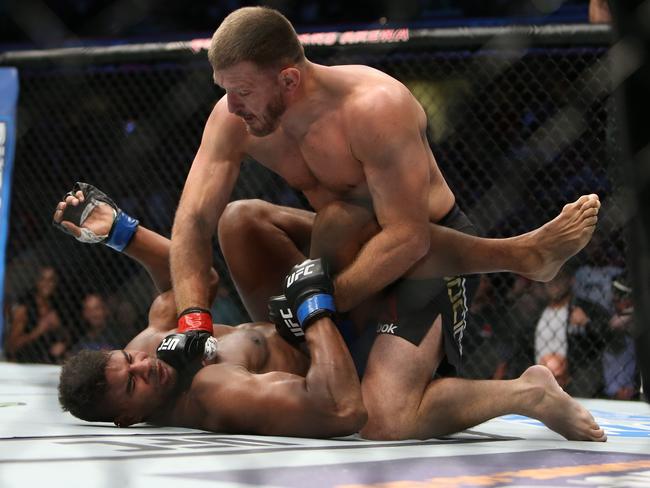 Stipe Miocic punches Alistair Overeem during UFC 203.