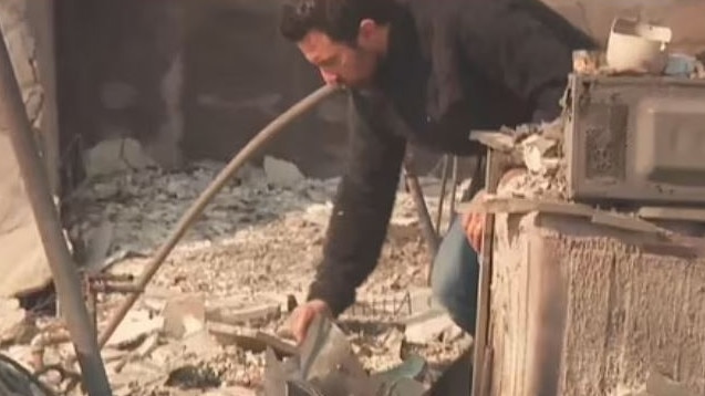 This is Us star Milo Ventimiglia looks through the remains of his charred home. Picture: Supplied