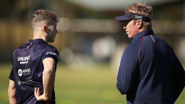 Walker talks to Roosters coach Trent Robinson at training. Picture: Matt King/Getty Images