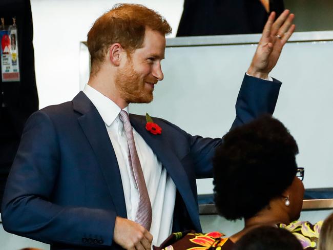 Prince Harry managed a smile for the crowd, despite England losing. Picture: AFP