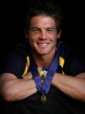 Former West Coast captain Cousins with his Brownlow Medal. 