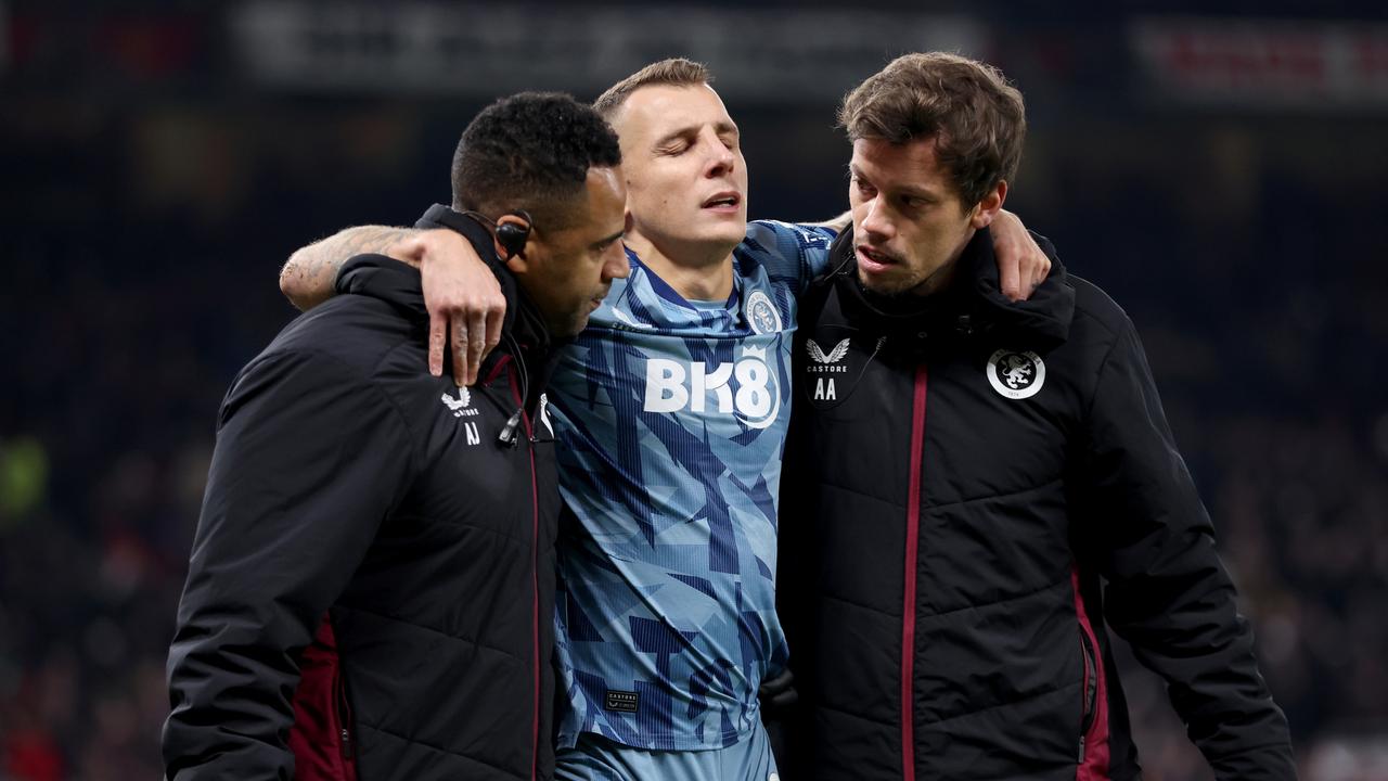 Lucas Digne of Aston Villa leaves the pitch after being injured. (Photo by Nathan Stirk/Getty Images)