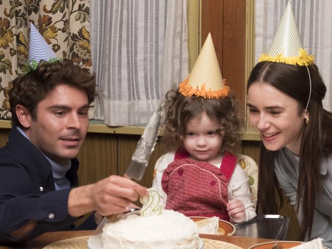 Zac Efron and Lily Collins in a scene from the Netflix movie.