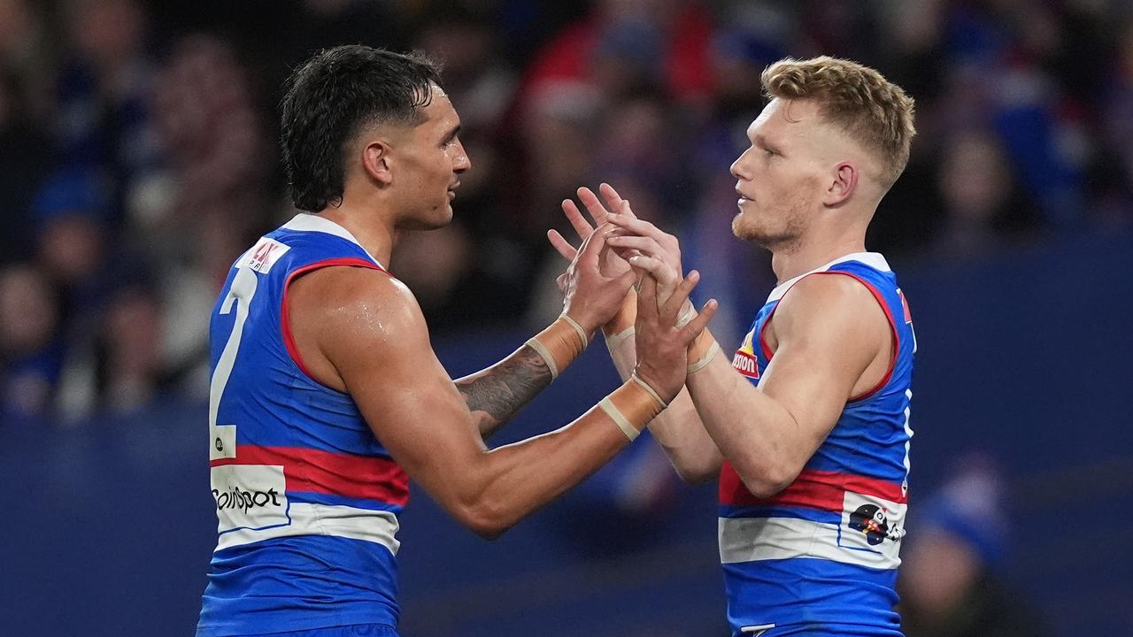 MELBOURNE, AUSTRALIA - JUNE 29: Adam Treloar of the Bulldogs celebrates kicking a goal during the round 16 AFL match between North Melbourne Kangaroos and Western Bulldogs at Marvel Stadium, on June 29, 2024, in Melbourne, Australia. (Photo by Daniel Pockett/Getty Images)