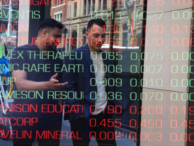 ????SYDNEY, AUSTRALIA : NewsWire Photos - FEBRUARY 24 2025; A general view of people walking past the digital boards of the ASX in the Sydney CBD. Picture: NewsWire/ Gaye Gerard