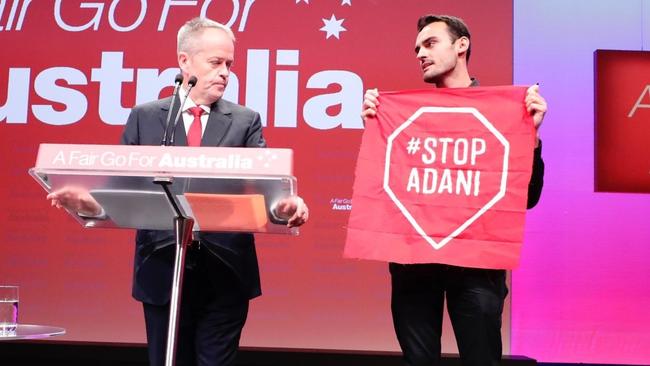 Isaac Astill and Bill Shorten on stage.