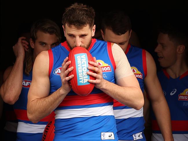 LAUNCESTON, AUSTRALIA - AUGUST 21: Marcus Bontempelli of the Bulldogs leads out team mates during the round 23 AFL match between the Hawthorn Hawks and the Western Bulldogs at University of Tasmania Stadium on August 21, 2022 in Launceston, Australia. (Photo by Mark Metcalfe/AFL Photos/via Getty Images)