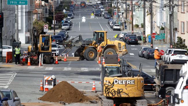 Workers operate a front loader as they make infrastructure repairs in San Francisco, California after Joe Biden introduced his $2 trillion infrastructure and jobs package that could potentially reshape the American economy.