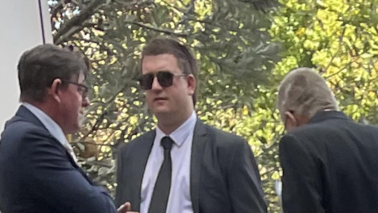 Jake Florussen (centre) speaks with his lawyer outside Geelong Law Courts following Monday’s hearing.