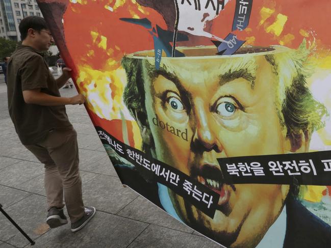 South Korean protesters carry a caricature of U.S. President Donald Trump during a rally to denounce the United States' policy against North Korea, near U.S. Embassy in Seoul, South Korea, Wednesday, Sept. 27, 2017. North Korea's top diplomat said Monday that a weekend tweet by Trump was a "declaration of war" and North Korea has the right to retaliate by shooting down U.S. bombers, even in international airspace. The caricature reads: "North Korea is destroyed." (AP Photo/Ahn Young-joon)