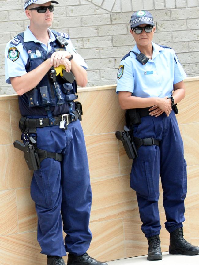 Police outside mosque yesterday.