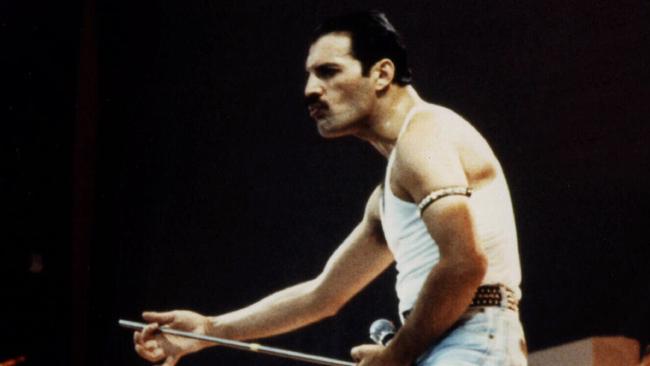  Freddie Mercury, lead singer with band Queen performing at Wembley Stadium for "Live Aid"