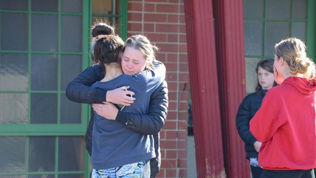 School friends and teammates at the scene of a fatal accident where a Lamborghini lost control and hit two 15-year-old girls outside the House Of Tien restaurant. Picture: Brenton Edwards/AAP