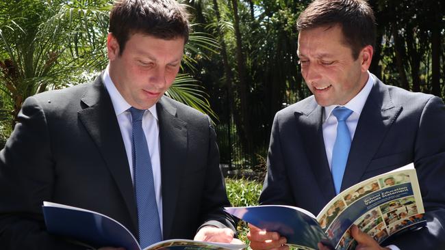 Liberal MP Tim Smith, left, with coalition leader Matthew Guy, has told councils they face the sack if refuse to hold citizenship ceremonies on Australia Day.