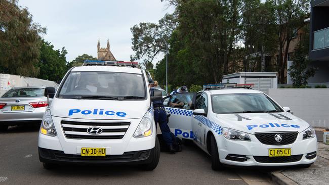 Police outside Ms Haddad’s apartment complex this morning. Picture: Monique Harmer