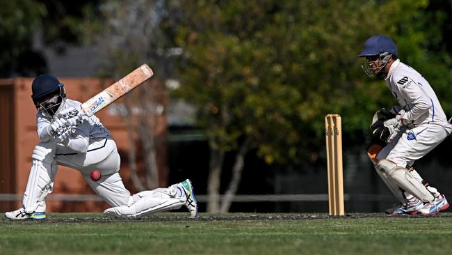 VTCA: St Albans’ Lihan Dulshan sweeps in front of Chetan Arjun of Keilor. Picture: Andy Brownbill