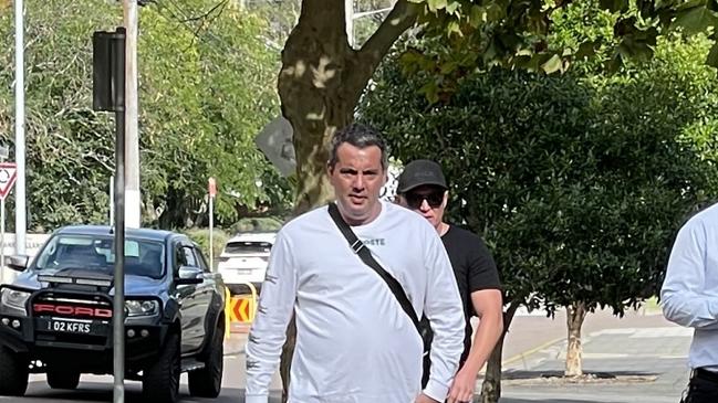 Timothy Marchment (white shirt), 47, of Blue Bay, arriving at Wyong Local Court where he pleaded guilty to commercial drug supply. Picture: NewsLocal