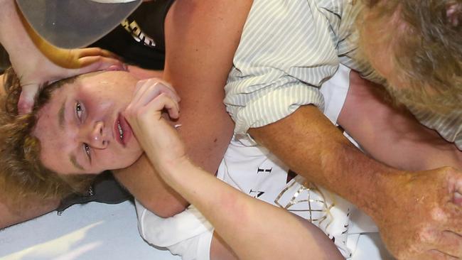 Fraser Anning’s supporters held down the teenager in the scuffle, which made international headlines. Picture: AAP Image/David Crosling