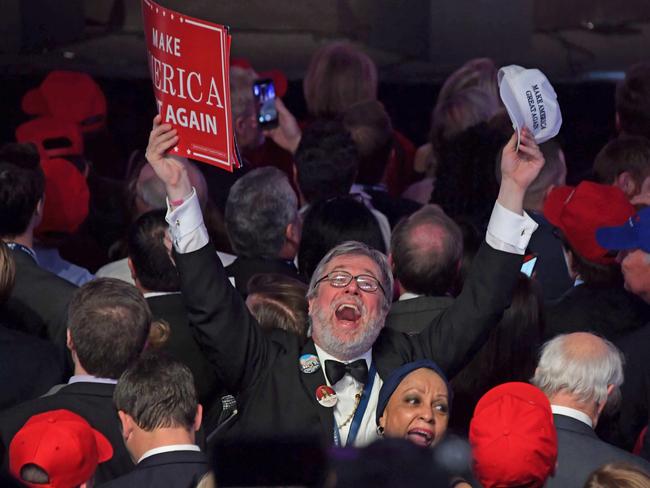 Supporters of Republican presidential nominee Donald Trump react during election night at the New York Hilton Midtown in New York on November 8, 2016. / AFP PHOTO / JIM WATSON