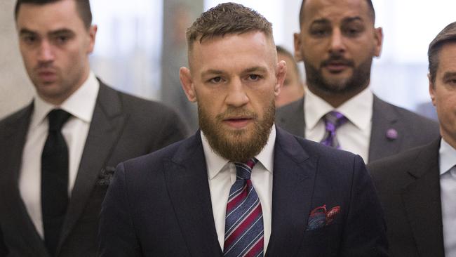 Conor McGregor leaves the courthouse.
