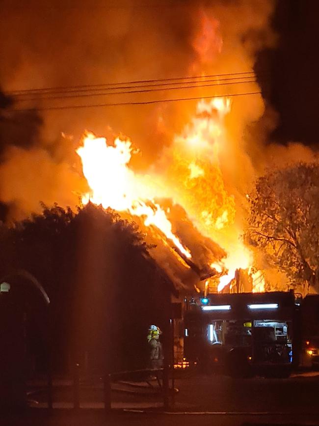 An old church on Arthur St, Roma collapses as it goes up in flames in the early hours of Wednesday morning, July 27. Picture: Facebook.