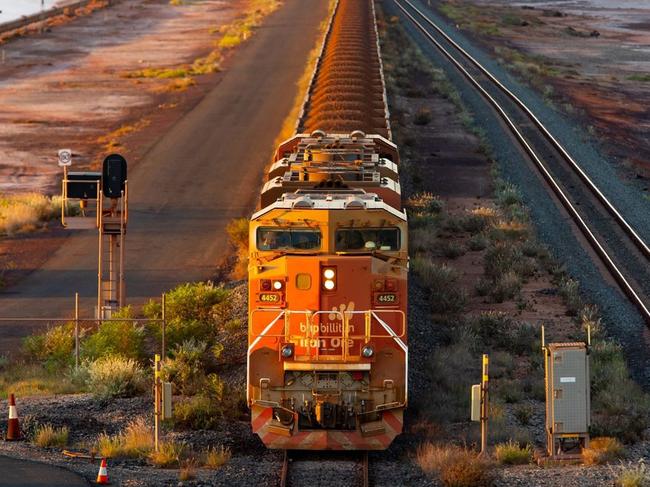 A BHP freight train carrying Australian iron ore to port. Australia ships around a third of its overall exports to China. PHOTO: IAN WALDIE/BLOOMBERG NEWS