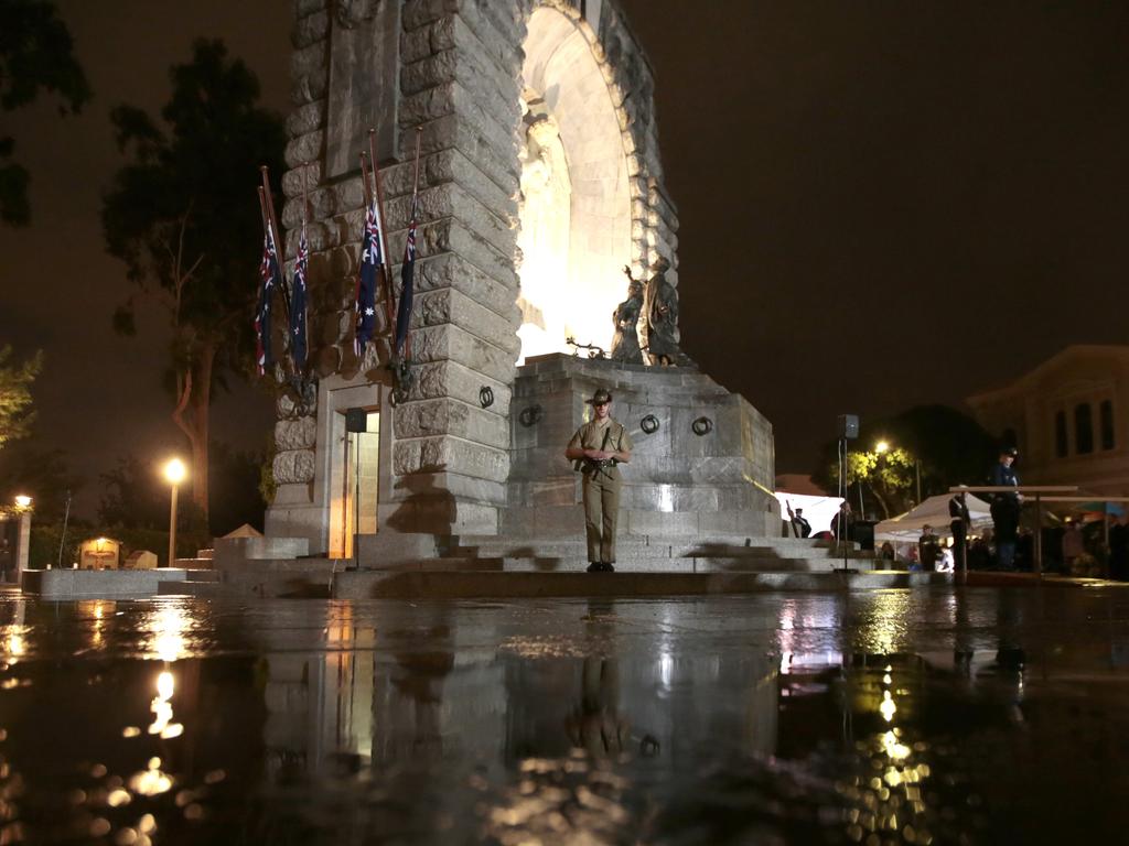 Wet weather did not deter many from the dawn service in the CBD. Picture: Tait Schmaal.