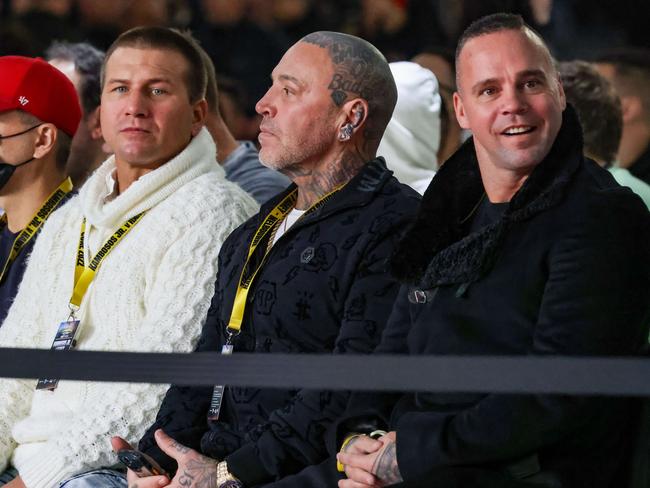 Toby Mitchell (centre) ringside at a boxing match with Jake King (right). Picture: Ian Currie