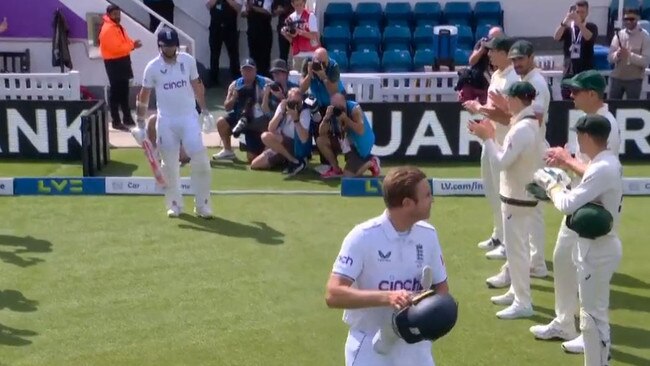 James Anderson follows behind Stuart Broad.