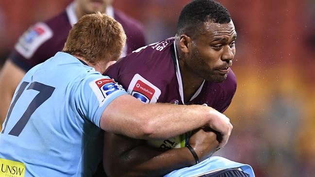 BRISBANE, AUSTRALIA - MAY 18: Samu Kerevi of the Reds is tackled during the round 14 Super Rugby match between the Reds and the Waratahs at Suncorp Stadium on May 18, 2019 in Brisbane, Australia. (Photo by Albert Perez/Getty Images)