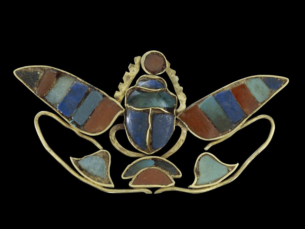 Ornament of a winged scarab holding a sun-disc. (about 880-1874 BC). Picture: The Trustees of the British Museum