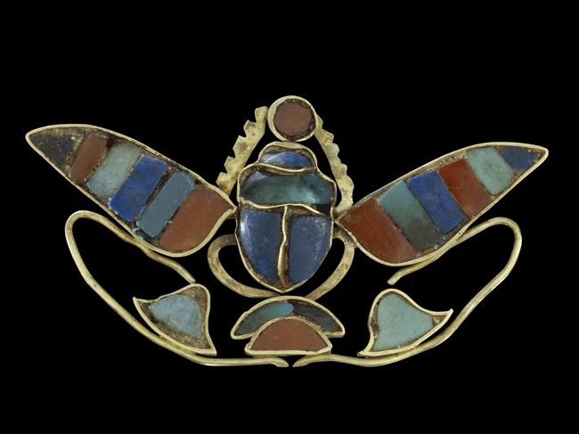 Ornament of a winged scarab holding a sun-disc. (about 880-1874 BC). Picture: The Trustees of the British Museum