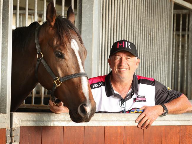 Top Queensland racehorse Rothfire with trainer Rob Heathcote, Eagle Farm. Picture: Liam Kidston
